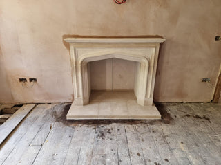 freshly installed and washed down hand carved fireplace