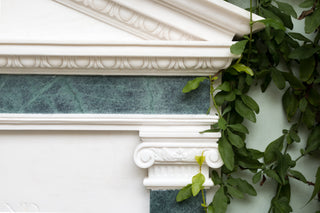 close up of a white and green marble fountain