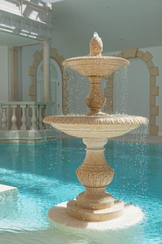 marble double tier fountain in an indoor swimming pool