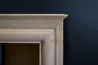 Corner edge of a stone carved fireplace