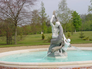 a bespoke fountain depicting two characters and a mythical creature