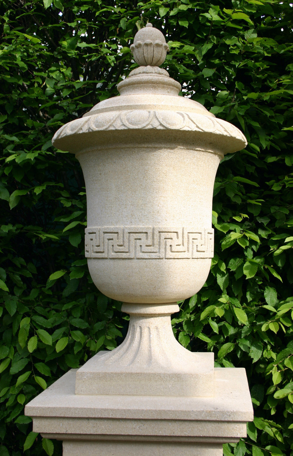 Large garden urn carved in solid sandstone