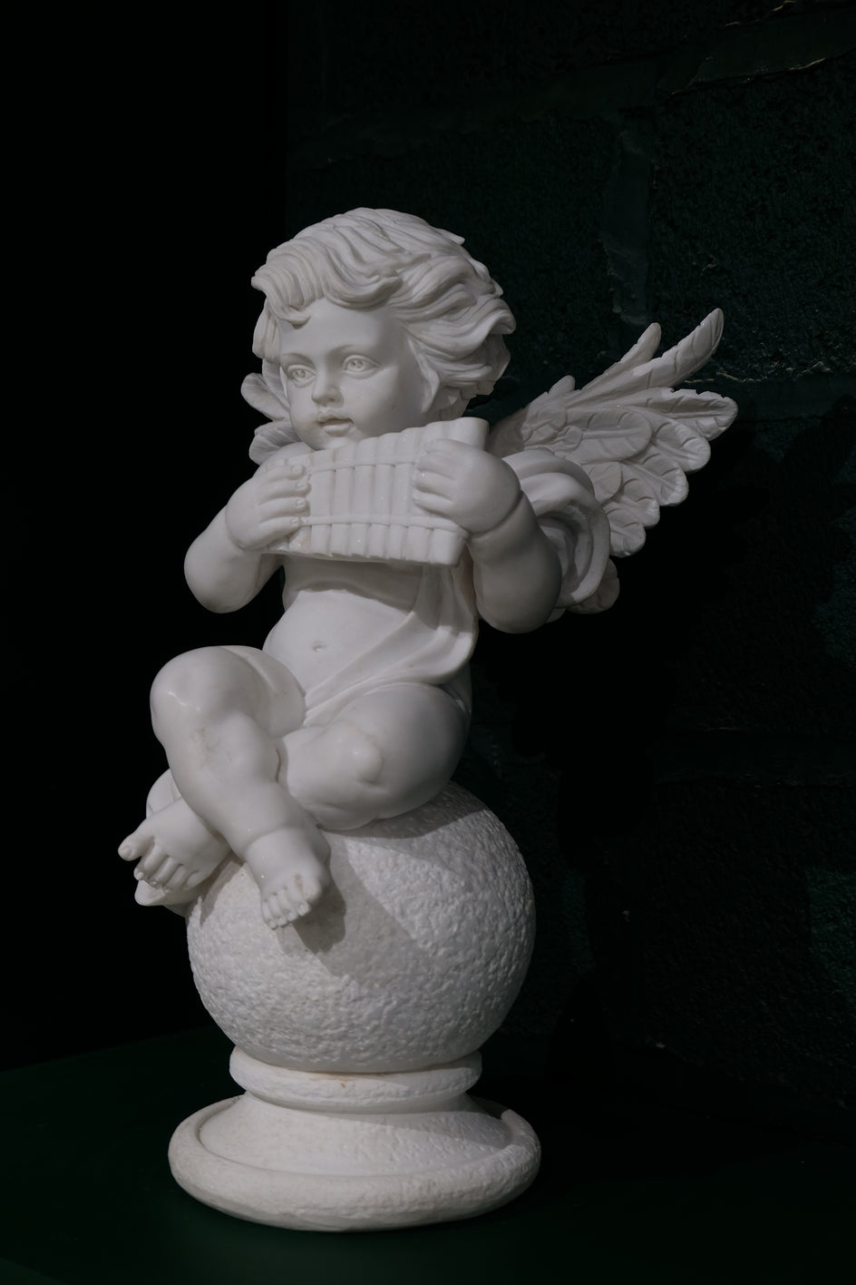 Cherub With Wind Instrument