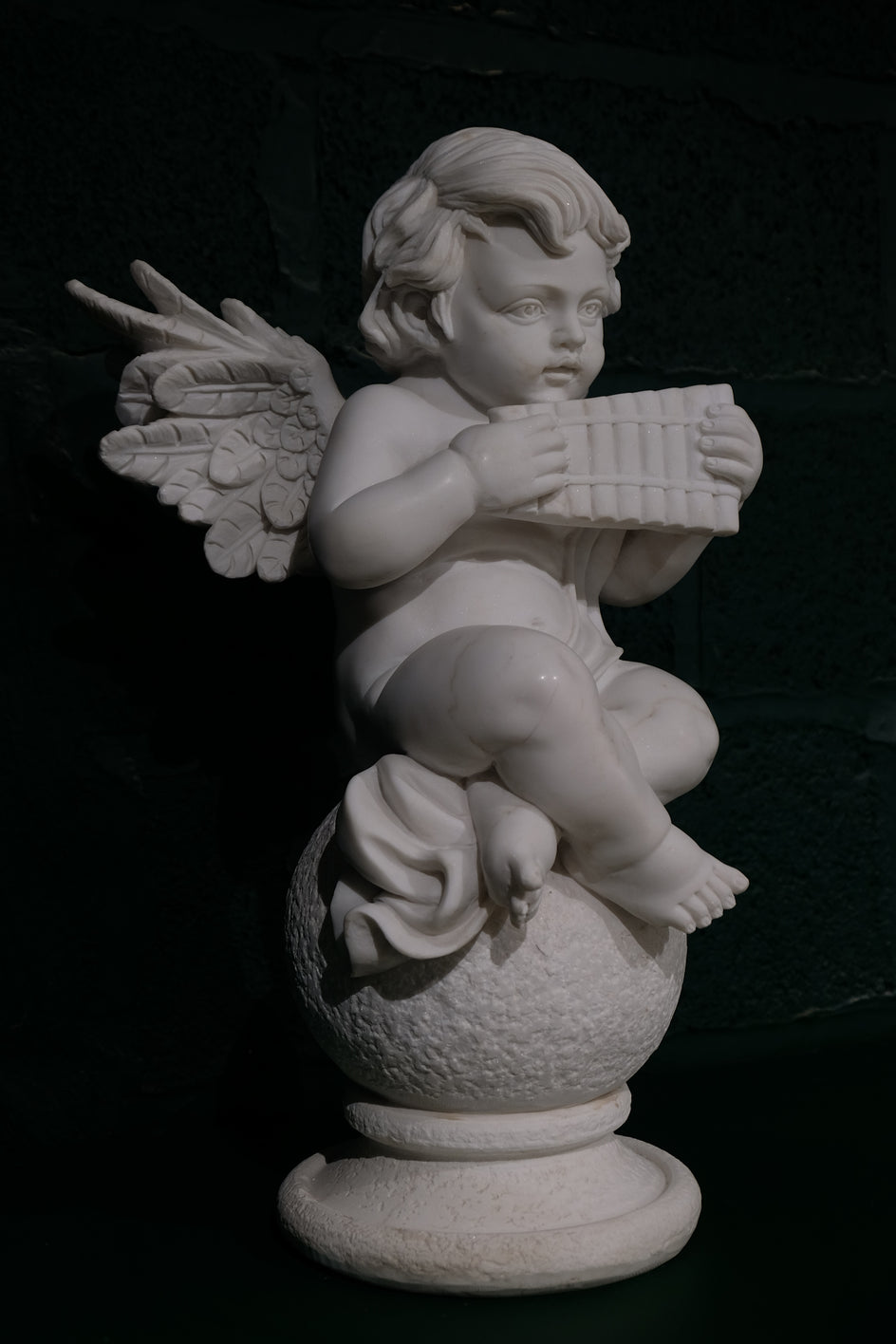 Cherub With Wind Instrument