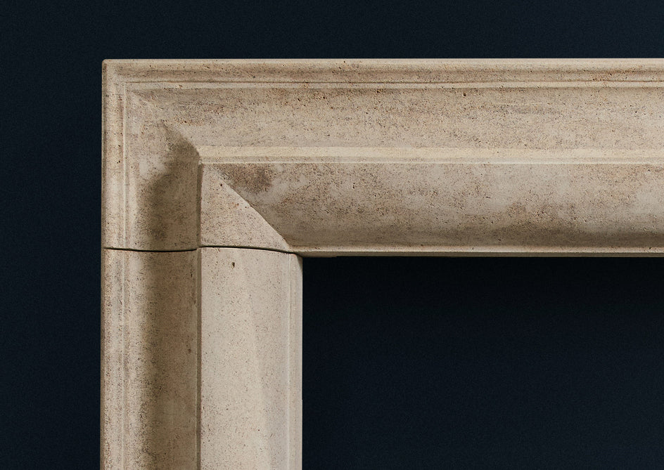 Corner detail of Straight Bolection limestone fireplace