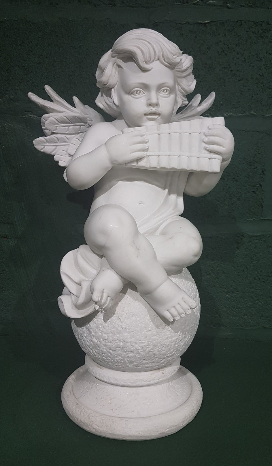 Cherub With Wind Instrument